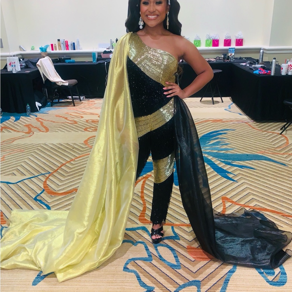 Black and Gold One-Shoulder Jumpsuit with Yellow Cape